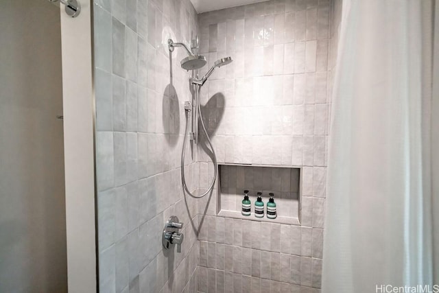 full bath with a tile shower