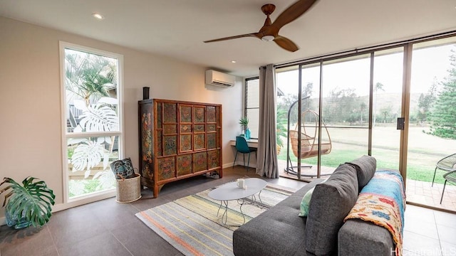 interior space with a wall unit AC, a ceiling fan, and recessed lighting