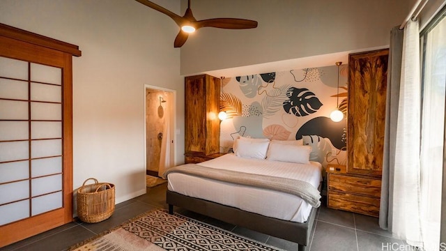 bedroom featuring ceiling fan and tile patterned flooring