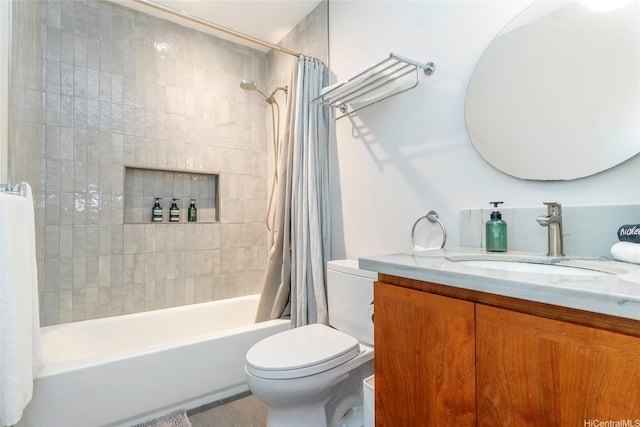 bathroom featuring toilet, shower / bath combo, and vanity