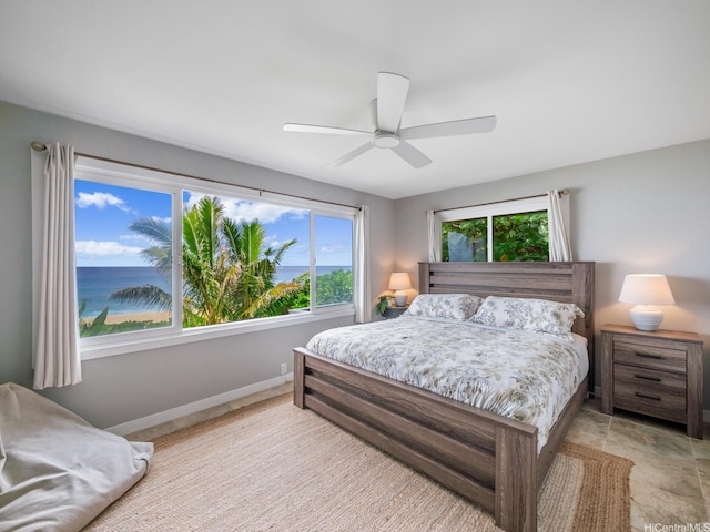 bedroom with baseboards and ceiling fan