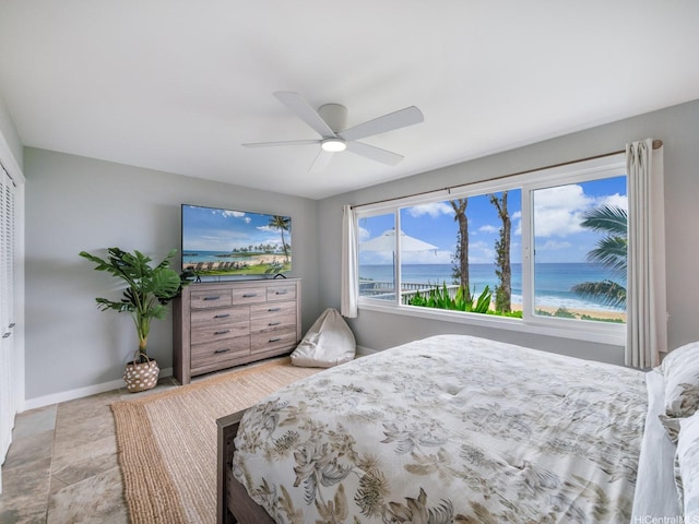 bedroom with baseboards and ceiling fan