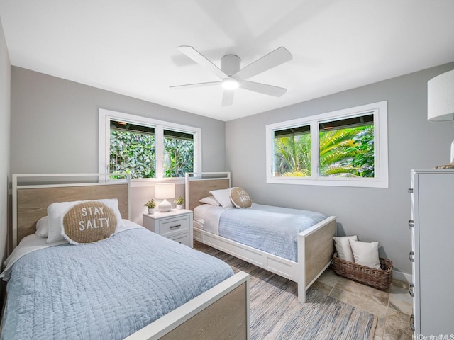 bedroom featuring a ceiling fan and light wood-style floors