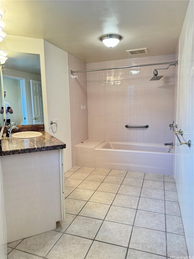 full bath with shower / bathing tub combination, visible vents, tile patterned floors, and vanity