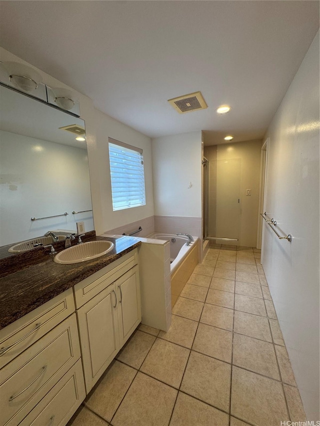 bathroom featuring a shower stall, tile patterned flooring, visible vents, vanity, and a garden tub