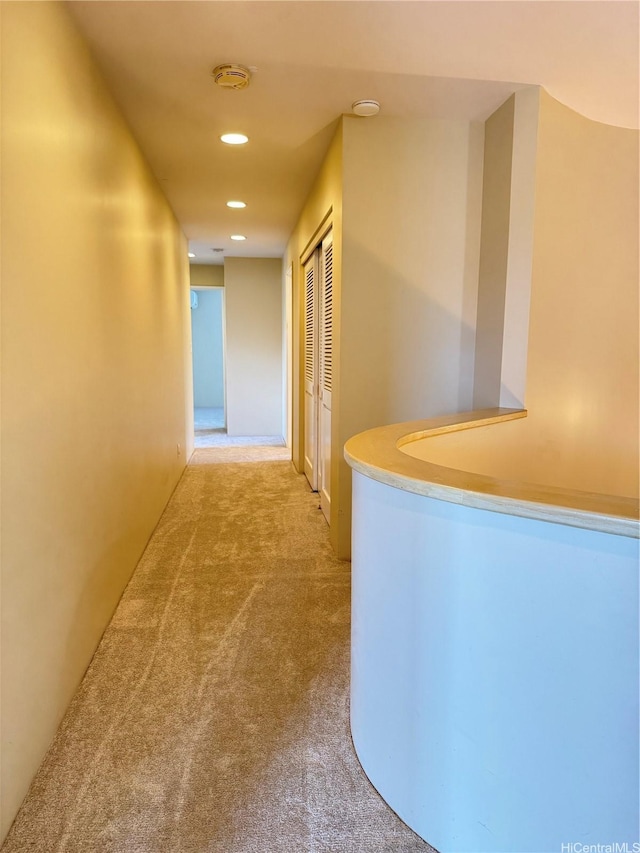 hallway featuring recessed lighting and carpet