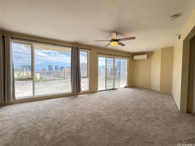unfurnished room featuring a city view, carpet, an AC wall unit, and a ceiling fan