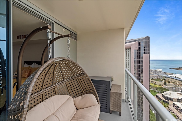 balcony featuring a water view