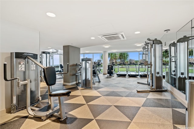 gym with recessed lighting, expansive windows, and light colored carpet
