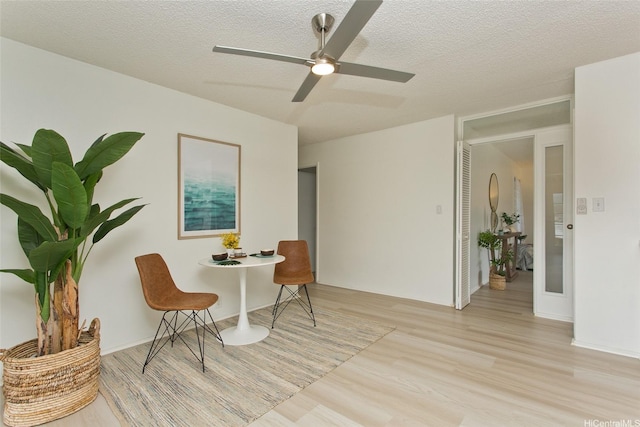 1334 Kuuna St, Kailua, HI 96734 - living area featuring light wood-style flooring, a textured ceiling, and ceiling fan