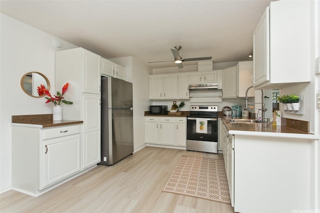 1334 Kuuna St, Kailua, HI 96734 - kitchen featuring freestanding refrigerator, stainless steel electric range, a sink, under cabinet range hood, and light wood-style flooring