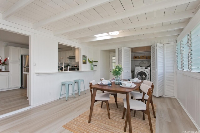 1334 Kuuna St, Kailua, HI 96734 - dining room featuring light wood finished floors, washer / dryer, beamed ceiling, and wooden ceiling