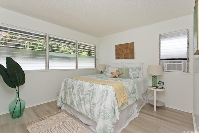 1334 Kuuna St, Kailua, HI 96734 - bedroom with wood finished floors, baseboards, and cooling unit