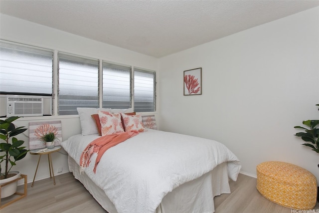 1334 Kuuna St, Kailua, HI 96734 - bedroom featuring wood finished floors, cooling unit, and baseboards