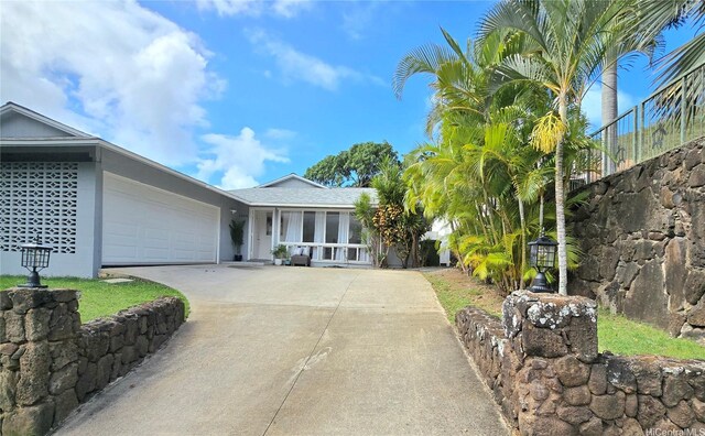 1334 Kuuna St, Kailua, HI 96734 - ranch-style house featuring concrete driveway and a garage