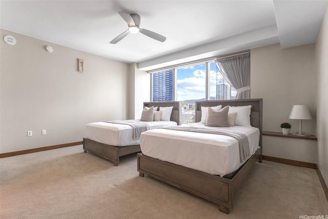 1555 Kapiolani Blvd Unit 1800, Honolulu, HI 96814 - bedroom with light colored carpet, baseboards, and ceiling fan
