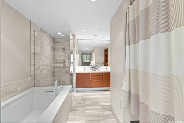 1555 Kapiolani Blvd Unit 1800, Honolulu, HI 96814 - full bath featuring a tile shower, a tub, recessed lighting, and double vanity