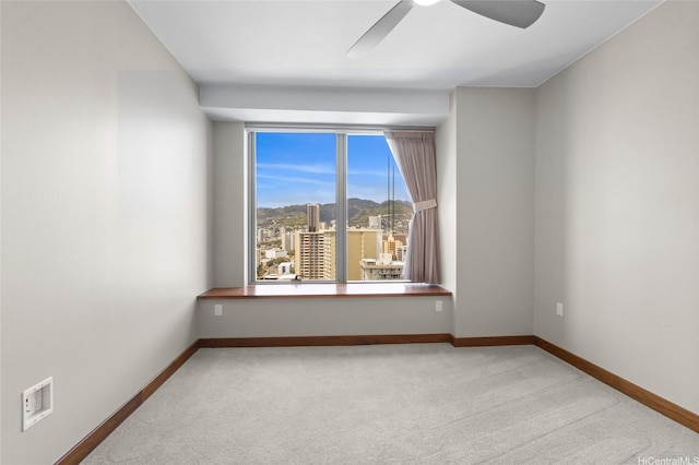 1555 Kapiolani Blvd Unit 1800, Honolulu, HI 96814 - carpeted empty room featuring baseboards and ceiling fan
