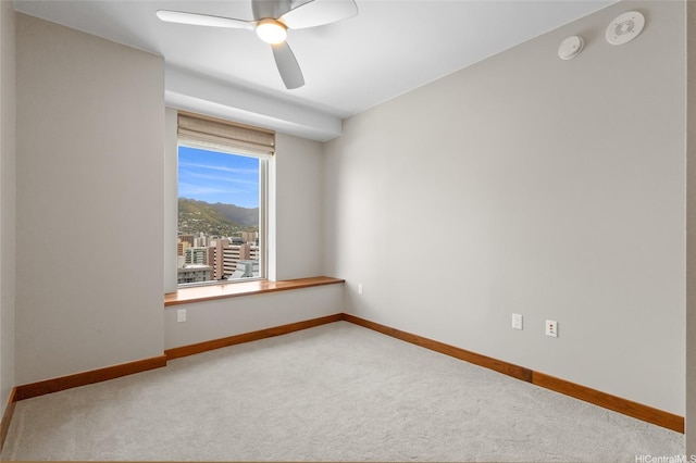 1555 Kapiolani Blvd Unit 1800, Honolulu, HI 96814 - unfurnished room featuring carpet floors, ceiling fan, baseboards, and a smoke detector