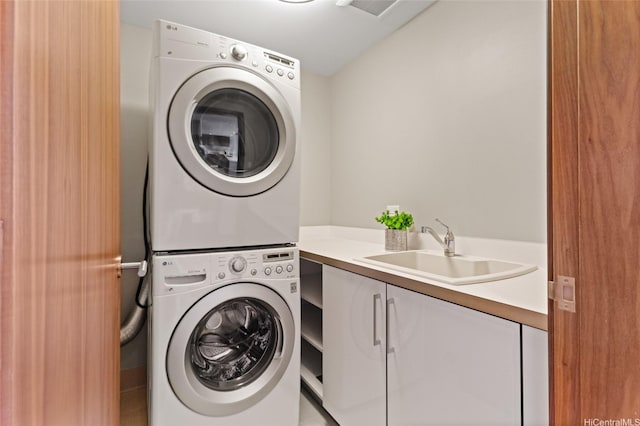 1555 Kapiolani Blvd Unit 1800, Honolulu, HI 96814 - laundry room with stacked washer / drying machine and cabinet space