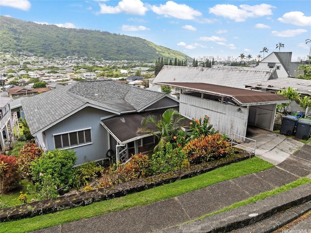 3251 Oahu Ave, Honolulu, HI 96822 - view of front of home featuring a carport, a shingled roof, driveway, and a mountain view