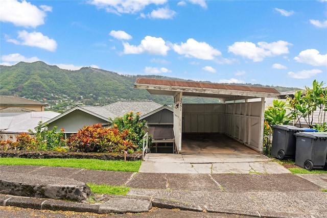3251 Oahu Ave, Honolulu, HI 96822 - view of front of property featuring a mountain view, concrete driveway, and a detached carport