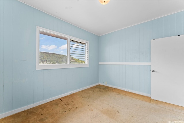 3251 Oahu Ave, Honolulu, HI 96822 - carpeted spare room featuring baseboards and wood walls