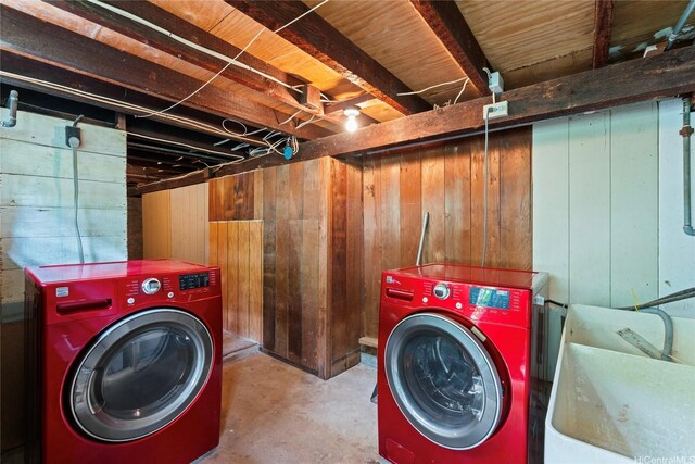 3251 Oahu Ave, Honolulu, HI 96822 - laundry area featuring washing machine and clothes dryer and wood walls