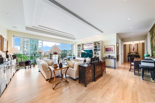 1740 S Beretania St Unit 9, Honolulu, HI 96826 - living area featuring light wood-style floors, recessed lighting, and a tray ceiling
