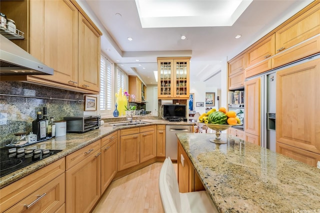 1740 S Beretania St Unit 9, Honolulu, HI 96826 - kitchen featuring dishwasher, light wood-style flooring, a sink, under cabinet range hood, and recessed lighting