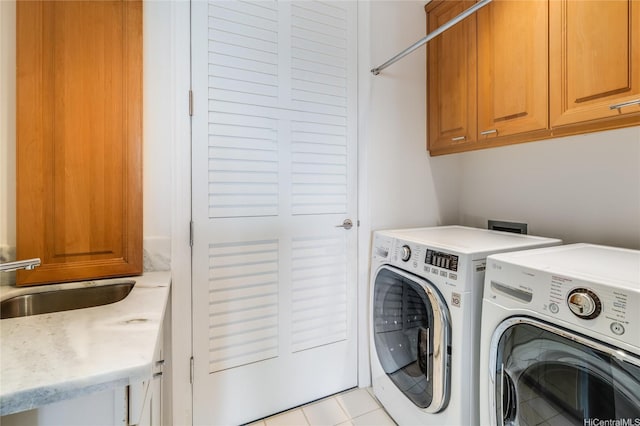 1740 S Beretania St Unit 9, Honolulu, HI 96826 - laundry area featuring cabinet space, independent washer and dryer, and light tile patterned flooring