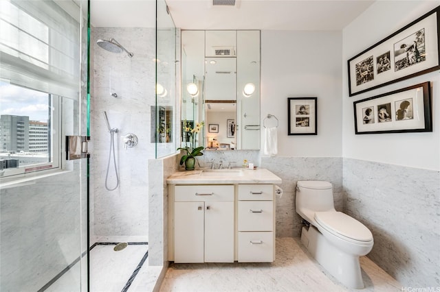 1740 S Beretania St Unit 9, Honolulu, HI 96826 - bathroom with tile walls, a marble finish shower, toilet, vanity, and a wainscoted wall