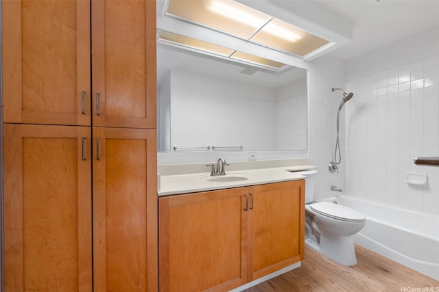 7188 Hawaii Kai Dr Unit 244, Honolulu, HI 96825 - bathroom featuring wood finished floors, toilet, vanity, and shower / tub combination