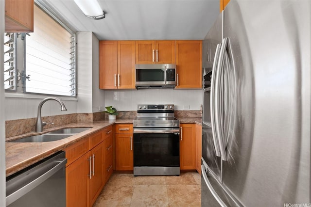 2920 Ala Ilima St Unit 1003, Honolulu, HI 96818 - kitchen featuring stainless steel appliances, a sink, light stone countertops, and brown cabinets