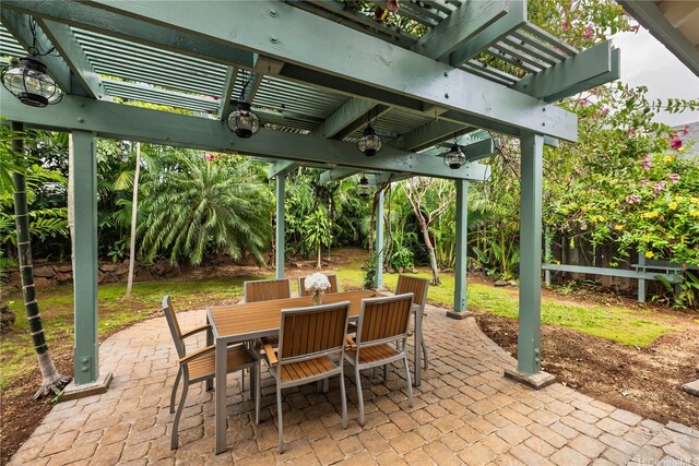 view of patio / terrace featuring a pergola and outdoor dining space