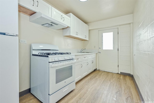 kitchen featuring light countertops, white appliances, light wood-style floors, white cabinetry, and extractor fan