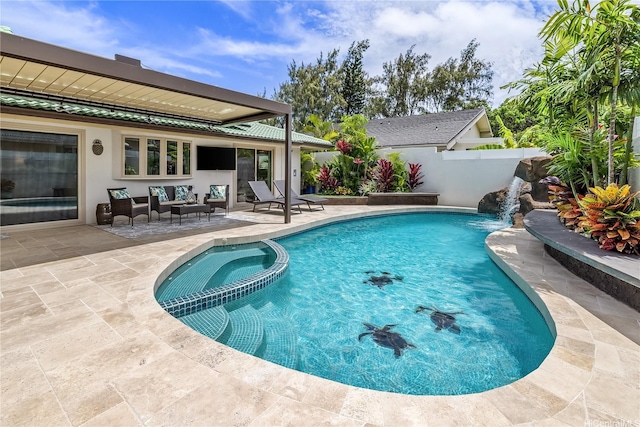 view of swimming pool featuring a patio area, a pool with connected hot tub, and fence
