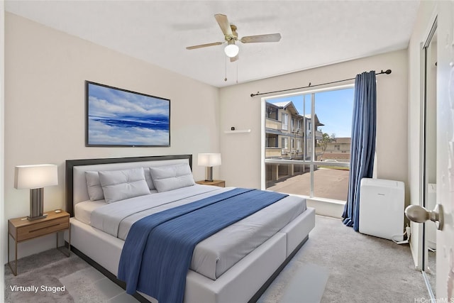 bedroom featuring carpet flooring, ceiling fan, and access to exterior