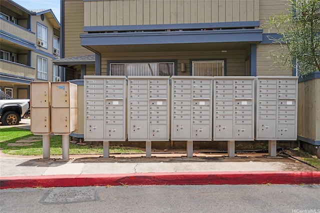 view of home's community featuring mail area