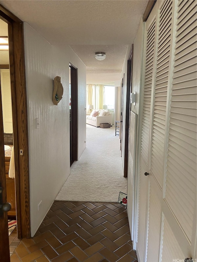 555 Hahaione St Unit 12D, Honolulu, HI 96825 - hall featuring carpet floors and a textured ceiling