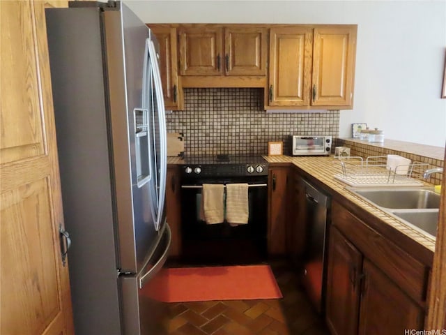 555 Hahaione St Unit 12D, Honolulu, HI 96825 - kitchen with stainless steel appliances, a sink, a toaster, backsplash, and brick floor
