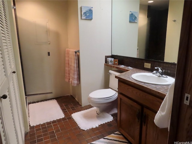 555 Hahaione St Unit 12D, Honolulu, HI 96825 - bathroom with decorative backsplash, vanity, tile patterned flooring, and toilet