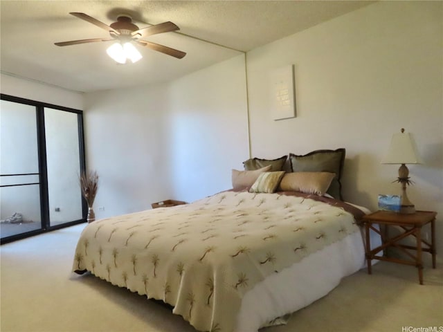 555 Hahaione St Unit 12D, Honolulu, HI 96825 - bedroom with a ceiling fan and light carpet