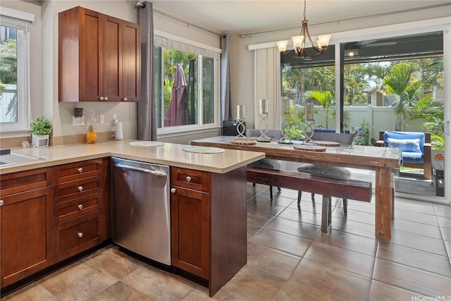 91-1154 Pekau St, Ewa Beach, HI 96706 - kitchen featuring stainless steel dishwasher, light countertops, a peninsula, a chandelier, and hanging light fixtures