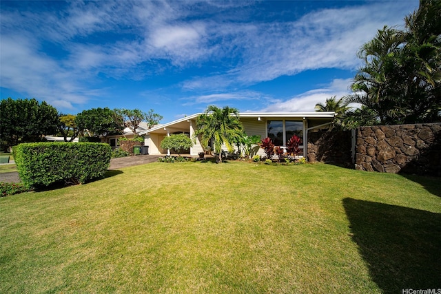 248 Aikane St, Kailua, HI 96734 - view of grassy yard featuring an attached carport