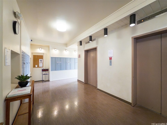 1571 Piikoi St Unit 1601, Honolulu, HI 96822 - hall featuring baseboards, elevator, and wood finished floors