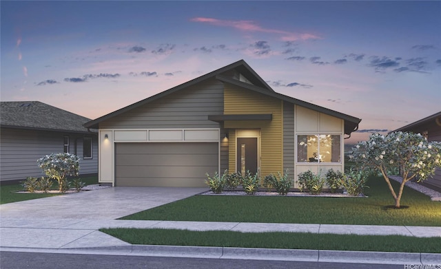 contemporary house featuring a garage, concrete driveway, and a front yard