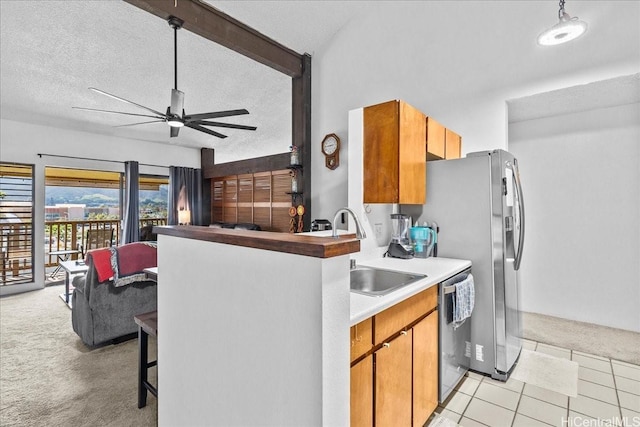46-020 Aliikane Pl Unit 325, Kaneohe, HI 96744 - kitchen with a kitchen breakfast bar, ceiling fan, stainless steel dishwasher, light colored carpet, and a sink