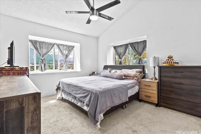 46-020 Aliikane Pl Unit 325, Kaneohe, HI 96744 - bedroom with vaulted ceiling, light colored carpet, a textured ceiling, and a ceiling fan