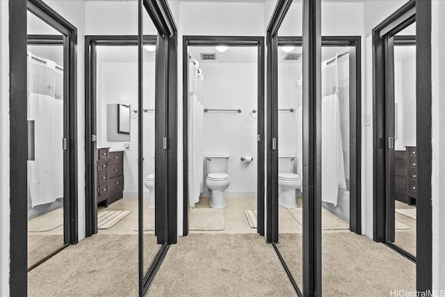 46-020 Aliikane Pl Unit 325, Kaneohe, HI 96744 - interior space with toilet, vanity, visible vents, and carpet floors